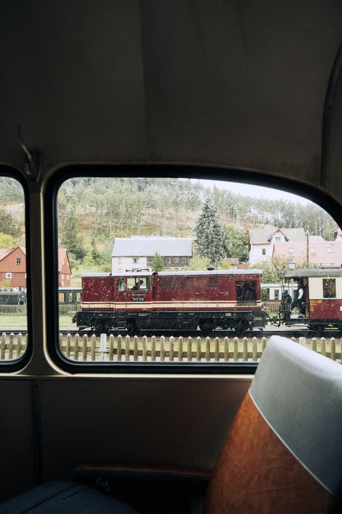 Free View of a classic train through a vintage coach window in Zittau, Germany. Stock Photo