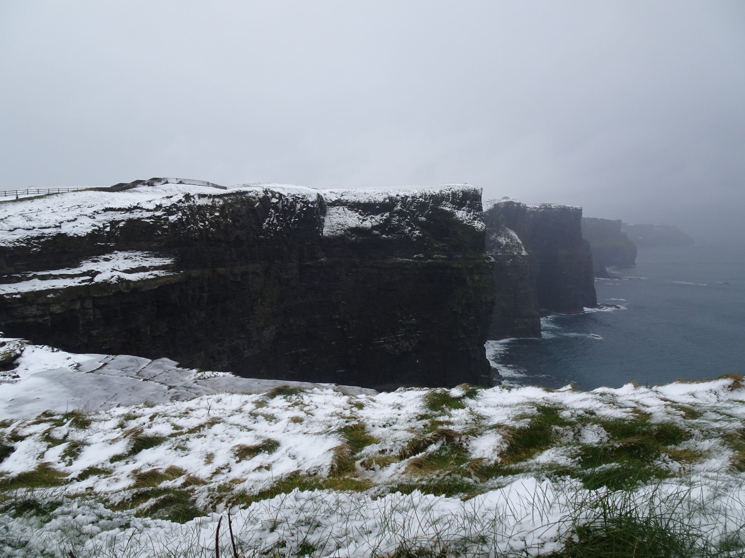 View of the Cliffs of Moher covered in snow during winter in County Clare, Ireland