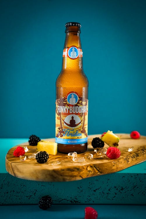 Free 
A Bottle of Beer on a Wooden Board Stock Photo