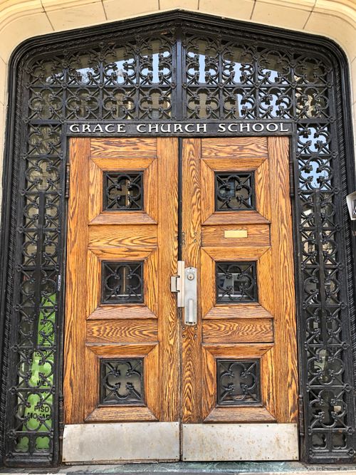 Free Ornate wooden doors of Grace Church School in New York City, showcasing intricate ironwork. Stock Photo