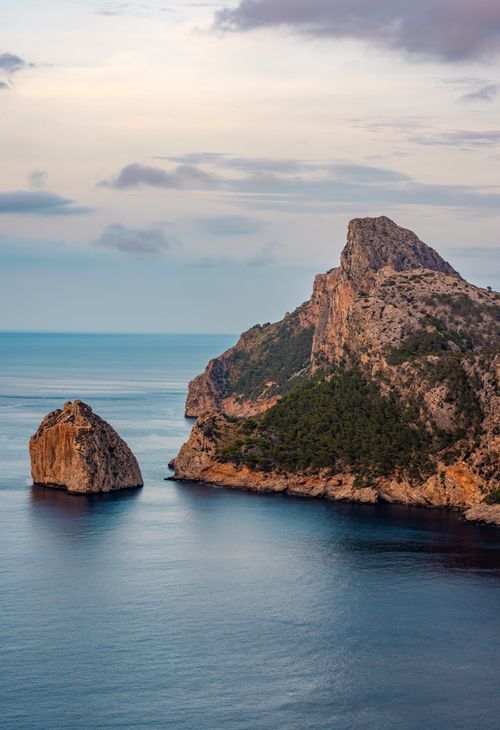 Free Scenic sunset at Sa Foradada, Mallorca's iconic rocky coastline with serene sea views. Stock Photo