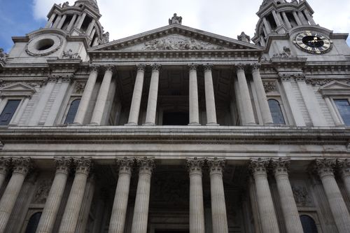 Free Majestic front view of St Paul's Cathedral in London, showcasing its grand architecture and iconic clock tower. Stock Photo