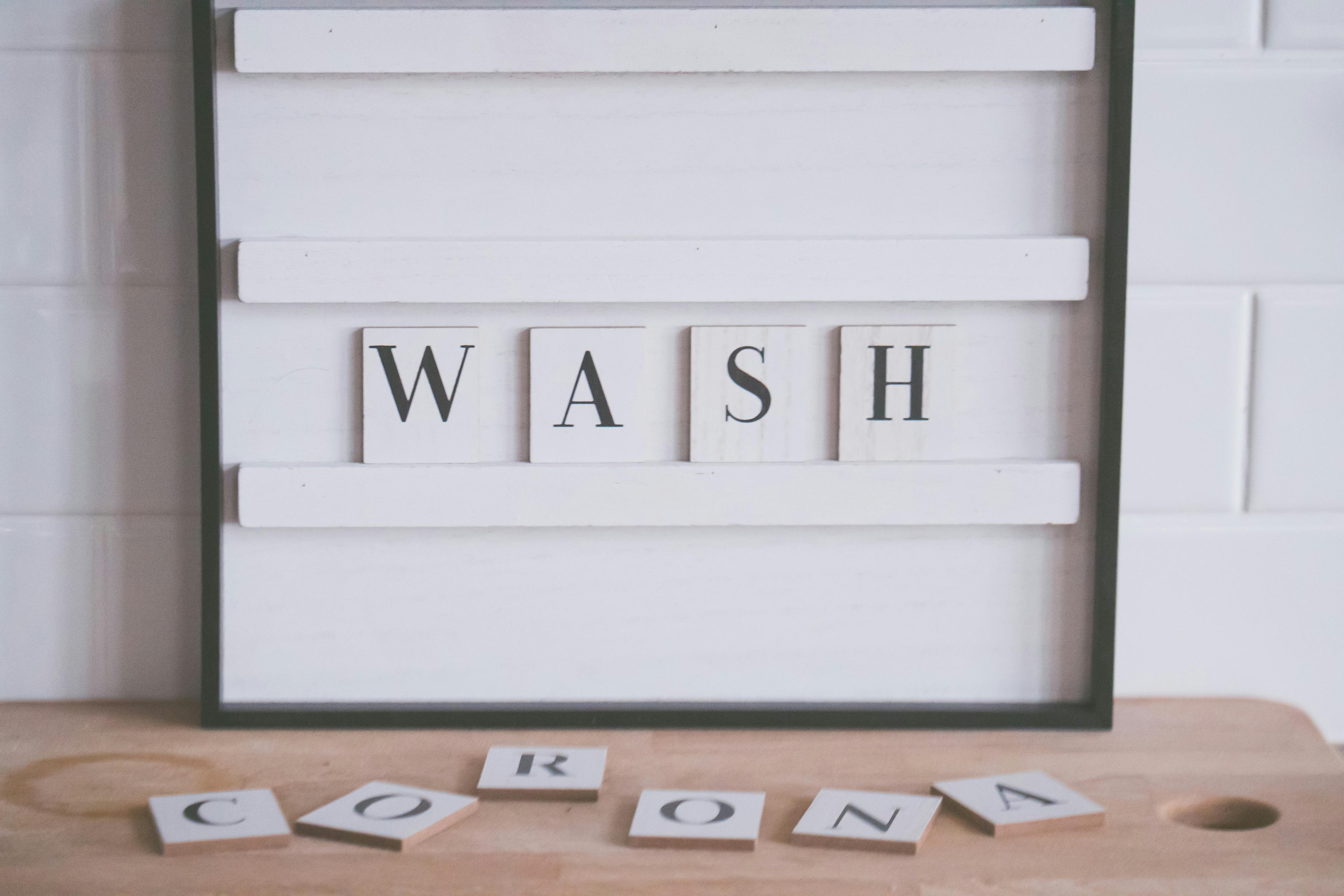wash and corona inscriptions in bathroom