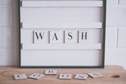 Wash and Corona inscriptions in bathroom