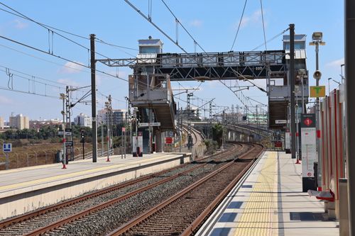 Free A sunny view of the San Fernando train station in Andalucía, Spain, showcasing tracks and infrastructure. Stock Photo