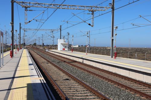 Free Railway tracks at San Fernando station in Andalucía, Spain under a clear sky. Stock Photo