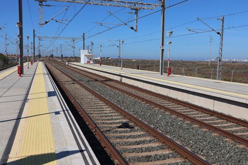 Free Empty railway station in San Fernando, Spain showcasing tracks and platforms under a clear blue sky. Stock Photo