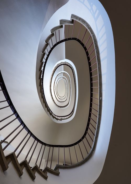 Free Photograph of a striking spiral staircase inside a modern building in Hamburg. Stock Photo