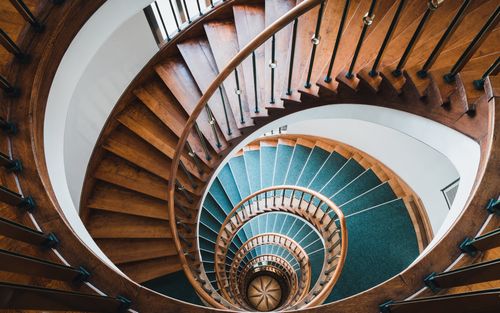 Free A stunning spiral staircase with wooden steps viewed from above in Hamburg, showcasing elegant architectural design. Stock Photo