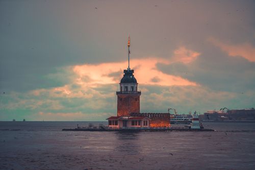 Free Captivating scene of Maiden's Tower in Istanbul with dramatic sunset sky. Stock Photo