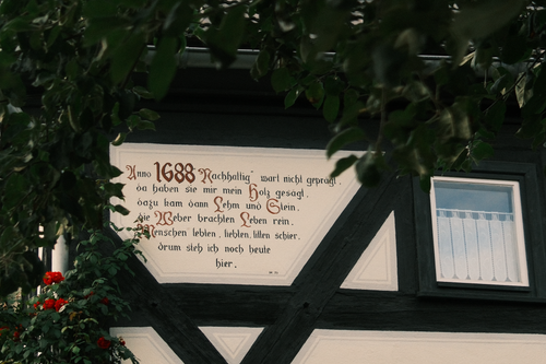 Free Timbered house with a historic inscription in Dittersdorf, showcasing traditional architecture. Stock Photo