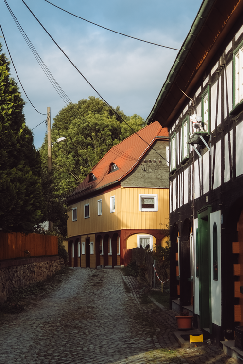 Free Rustic street scene in Dittersdorf, Germany, showcasing traditional half-timbered architecture. Stock Photo