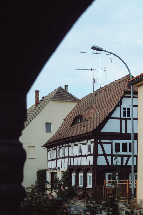 Free A picturesque half-timbered house in Dittersdorf, Thüringen, showcasing traditional German architecture. Stock Photo