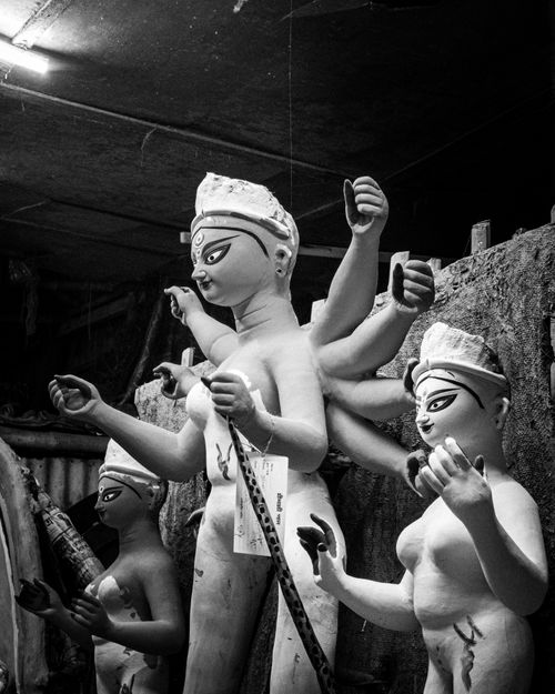 Free Black and white image of Durga idols in a Kolkata workshop, highlighting craftsmanship and cultural heritage. Stock Photo
