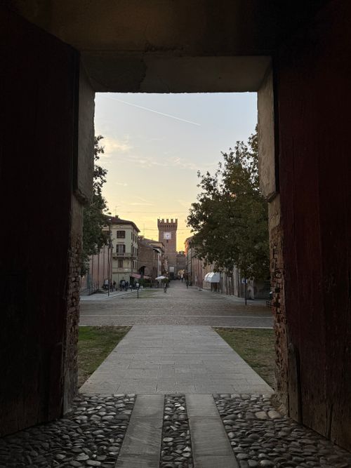 Free Sunset view through an archway in Spilamberto, Italy, showcasing historical architecture. Stock Photo