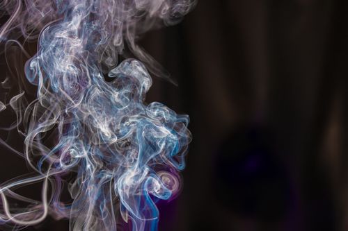 Free A captivating display of colorful smoke swirls against a dark background, showcasing artistic fluidity and dynamic curves. Stock Photo