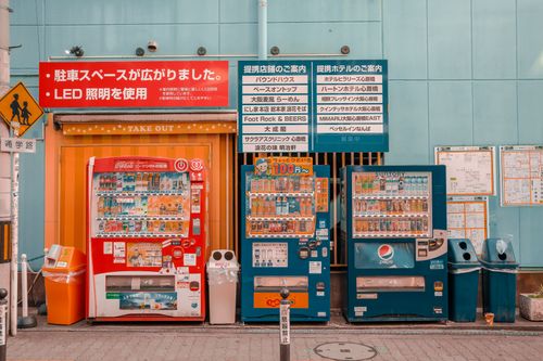 Free Colorful vending machines in a Japanese urban street scene, vibrant and inviting locale. Stock Photo