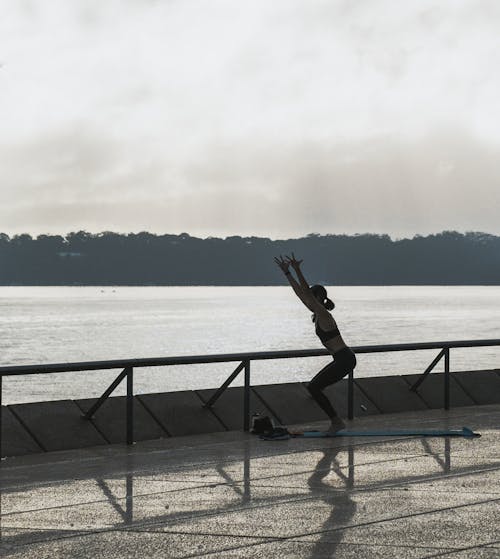 
A Woman Exercising with a View of the Ocean
