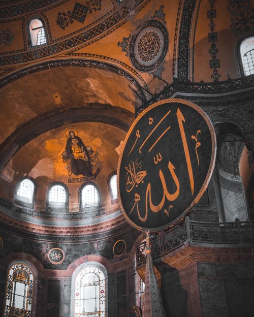 Free Illuminated interior of Hagia Sophia, Istanbul showcasing religious iconography and architectural design. Stock Photo