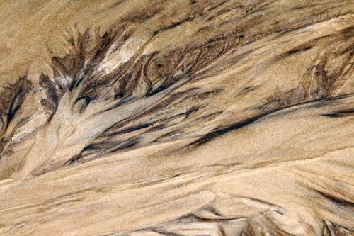 Free Intricate natural sand patterns on a beach in Paraná, Brazil, showcasing fluid textures. Stock Photo