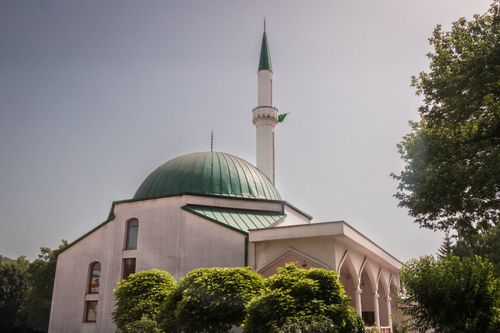Free A beautiful mosque with a green dome under a clear sky in Sarajevo, Bosnia. Stock Photo