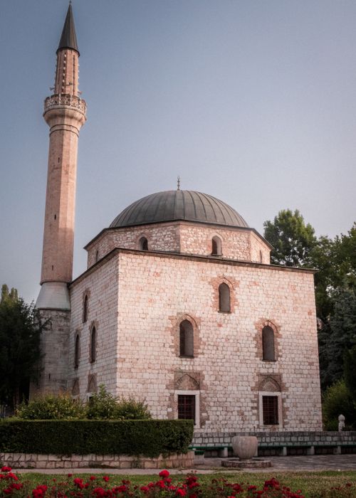 Free A serene view of the historic Gazi Husrev-beg Mosque with its iconic minaret in Sarajevo. Stock Photo