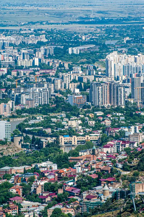 Free Explore the vibrant skyline and diverse architecture of Tbilisi, Georgia from an aerial perspective. Stock Photo