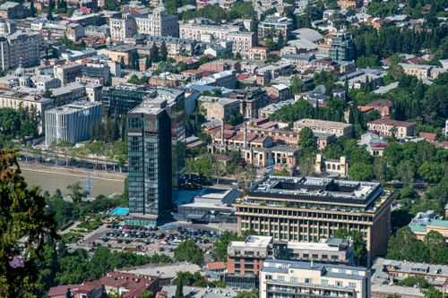 Free Elevated view of Tbilisi cityscape with modern and historic buildings, showcasing vibrant urban life. Stock Photo