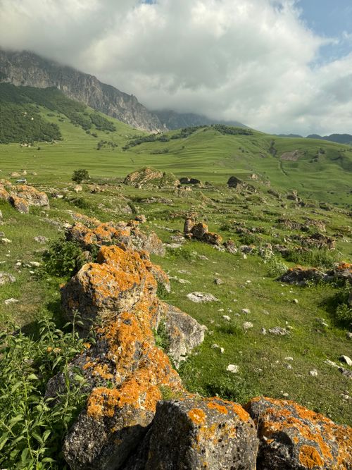 Free Scenic view of lush green mountains and fields in Kabardino-Balkaria, Russia. Stock Photo