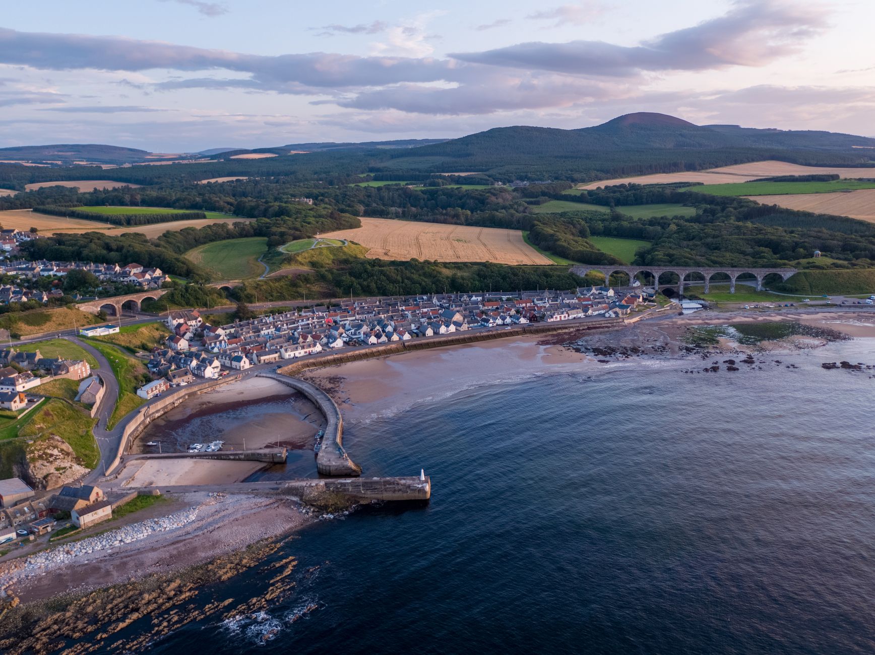 Drone view of Cullen's picturesque coastline with the historic railway viaduct, Moray, Scotland