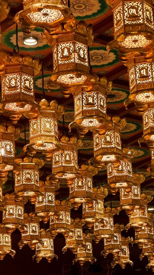 Free Beautifully illuminated traditional Asian lanterns hanging indoors in Singapore, creating a warm ambiance. Stock Photo