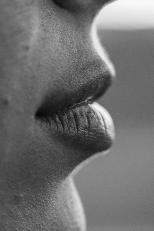 Free Artistic close-up view of human lips in black and white, highlighting texture and expression. Stock Photo