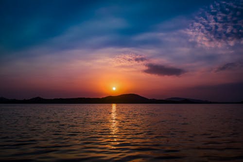 Free Body Of Water During Sunset Stock Photo