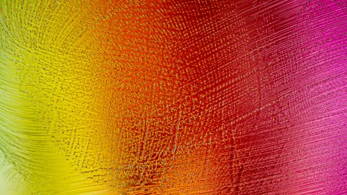 Free Colorful abstract texture art with vibrant pink and yellow gradient brushstrokes. Stock Photo