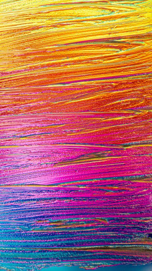 Free A vibrant abstract artwork with bold textured streaks of color, creating a vivid visual impact. Stock Photo