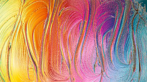 Free Colorful abstract artwork with vibrant swirling paint strokes in warm tones. Stock Photo