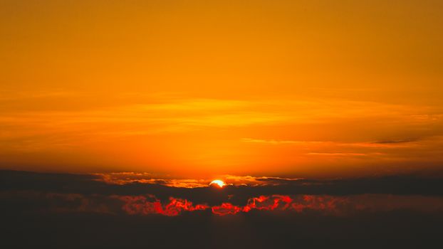 Breathtaking sunset with vibrant orange hues over Cửa Tùng, Vietnam.