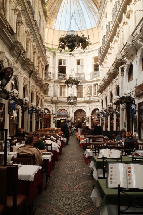 Free Explore a vibrant café scene inside an elegant historical arcade in İstanbul, Turkey. Stock Photo