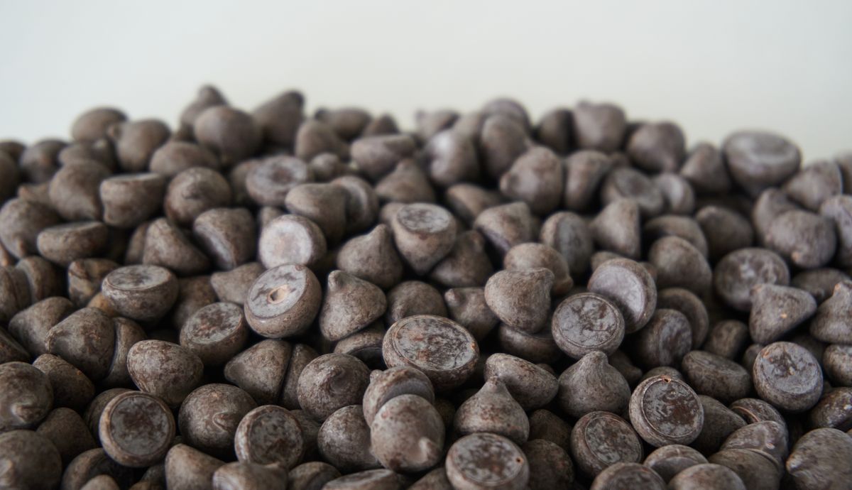 A detailed view of dark chocolate chips, perfect for baking needs.