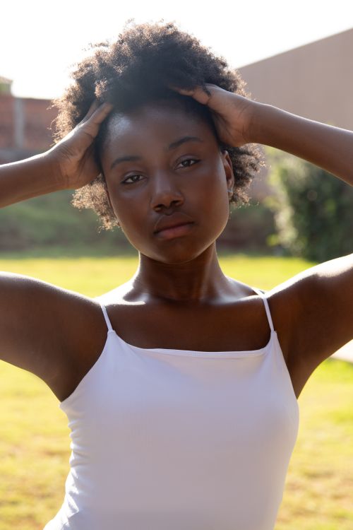 Free Relaxed outdoor portrait of a young woman in summer light. Stock Photo