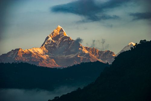 Free Breathtaking sunrise view of Machhapuchhre Mountain, also known as Fishtail, in the Himalayas of Nepal. Stock Photo