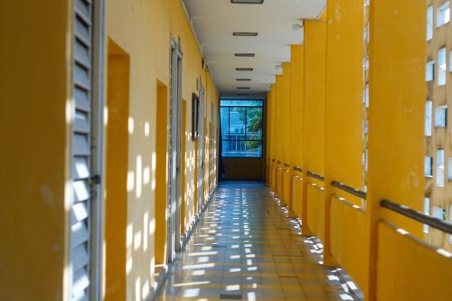 Free Bright yellow corridor in Hue, Vietnam showcasing modern architecture and natural lighting. Stock Photo