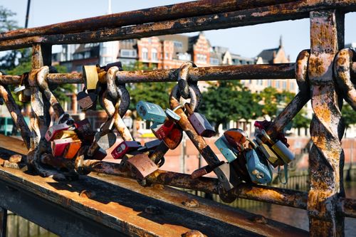 Free Colorful love padlocks adorn a bridge in Hamburg, Germany, symbolizing love and commitment. Stock Photo