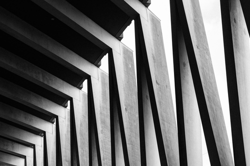 Free Black and white photo of modern architectural beams in Amsterdam, showcasing geometric lines and patterns. Stock Photo
