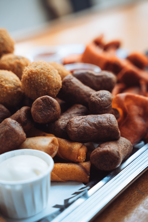Free A variety of Dutch finger foods, including bitterballen and frikandelletjes, served at an Amsterdam café. Stock Photo