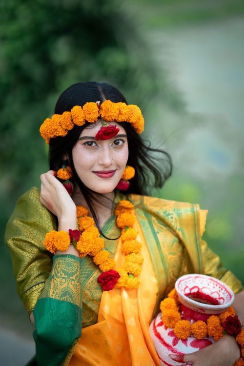 Free Portrait of a South Asian woman in traditional attire with floral decorations, exuding cultural elegance. Stock Photo