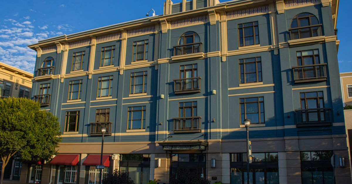 Charming architectural design of a four-story building in Hampton, Virginia, captured in evening light.