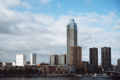 Free Explore the striking skyline of Rotterdam featuring modern skyscrapers under a clear blue sky. Stock Photo