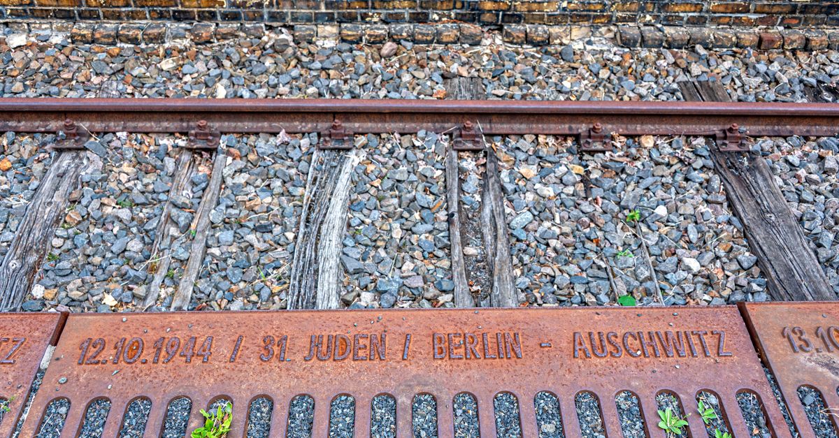 Historic railway tracks memorializing Holocaust deportations from Berlin to Auschwitz.