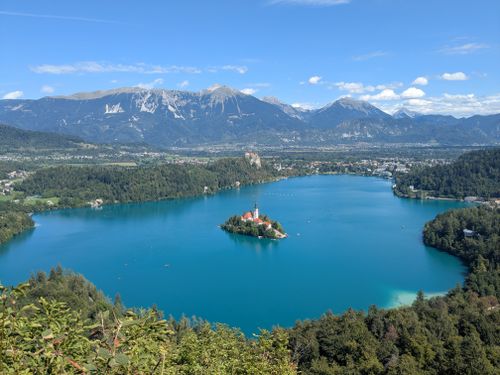 Free A stunning aerial view of Lake Bled surrounded by mountains, featuring the iconic island. Stock Photo